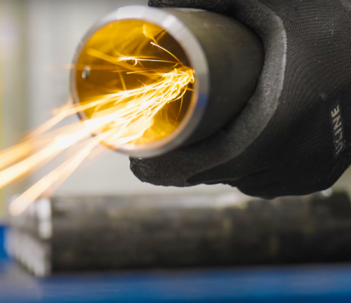 Hydraulic cylinder tube being deburred